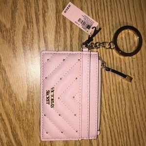 Pink VS wristlet. New w/ tags. Never used.